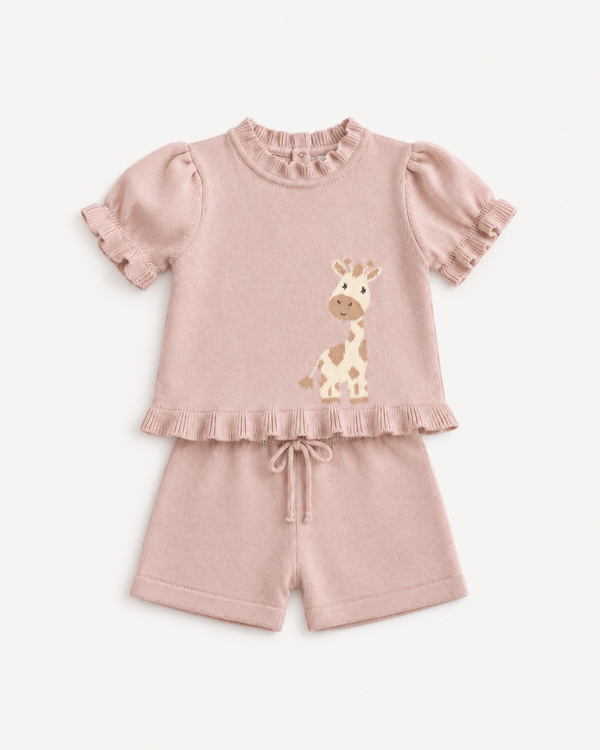 A baby girl's two-piece knit outfit in dusty pink, featuring a short-sleeve top with ruffled trim and a cartoon giraffe applique, paired with matching ruffled shorts with a drawstring.