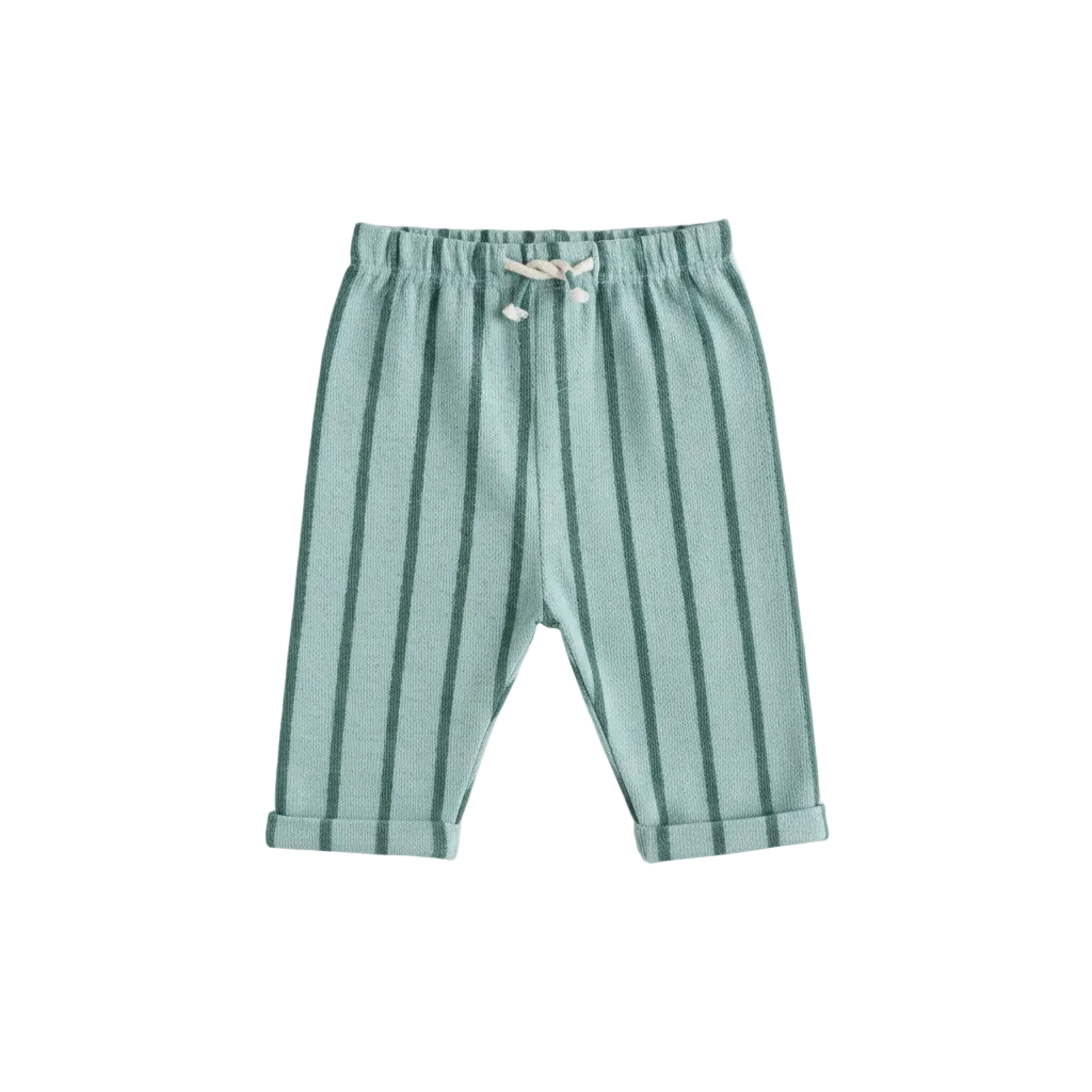 Green striped baby pants hanging on a wooden rod against a light gray background