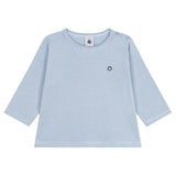 A light blue and white striped long-sleeve t-shirt with a small circular logo on the left chest, displayed flat against a solid white background.