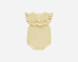 A pale yellow crocheted baby romper with ruffled shoulder straps, displayed flat against a light gray background.
