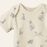 Baby onesie with dog pattern on a white background
