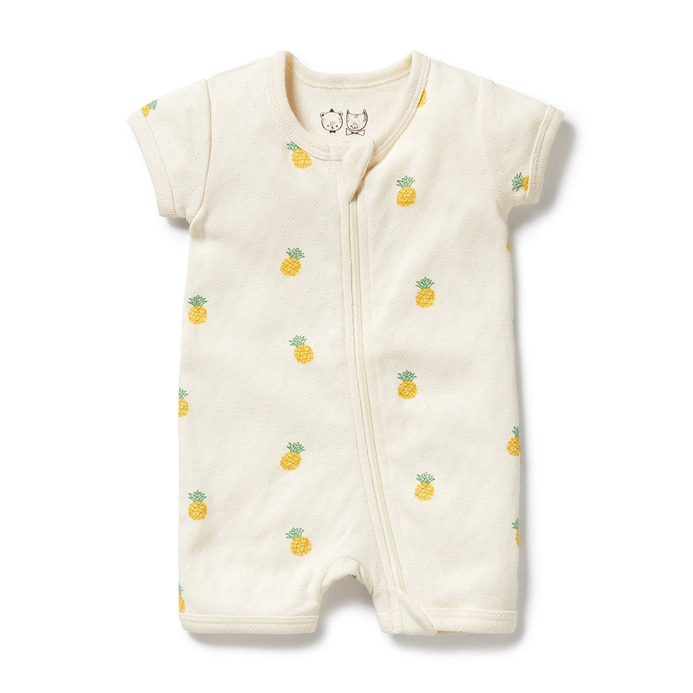 Baby romper with pineapple pattern on a white background