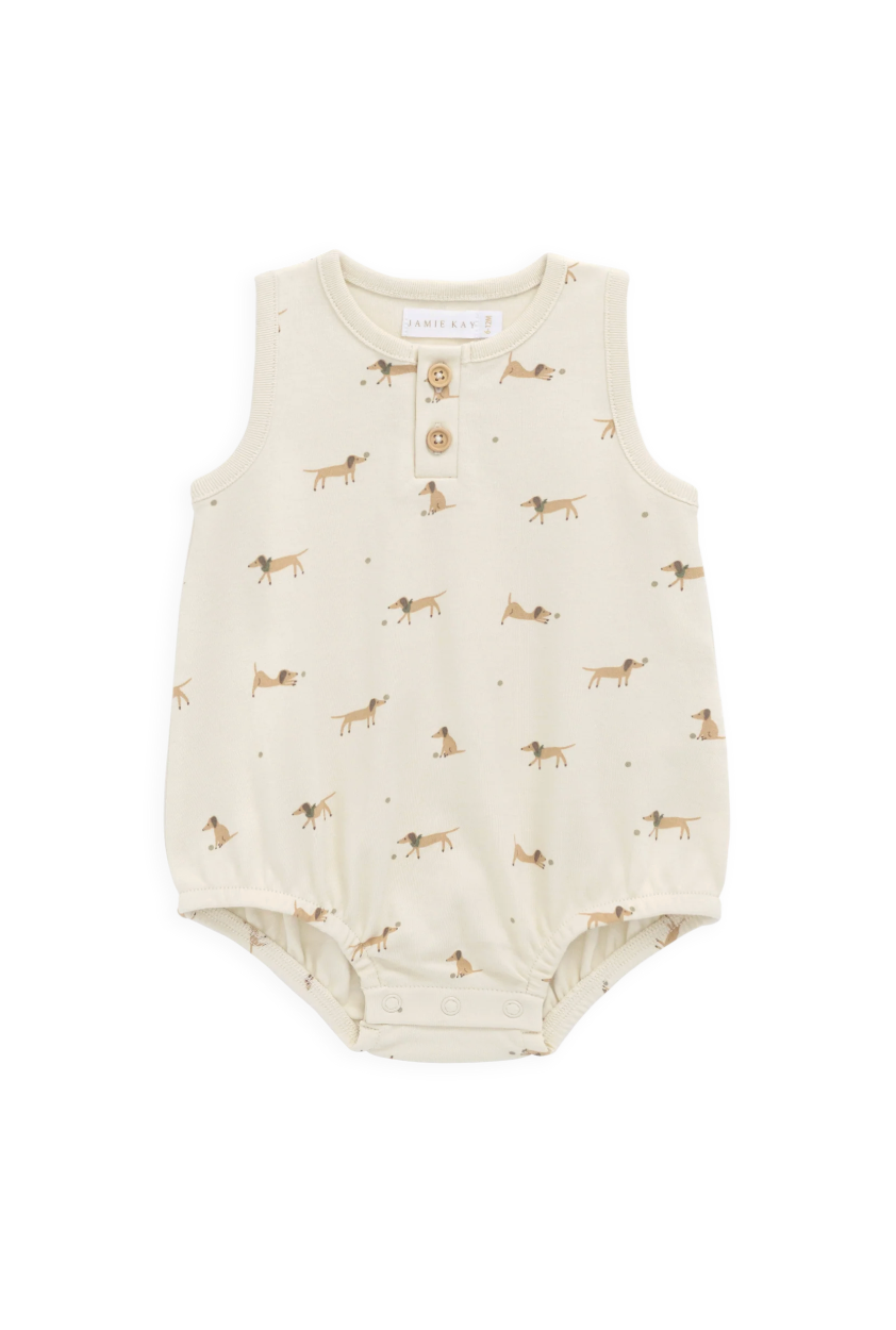 Baby romper with dog pattern on a white background