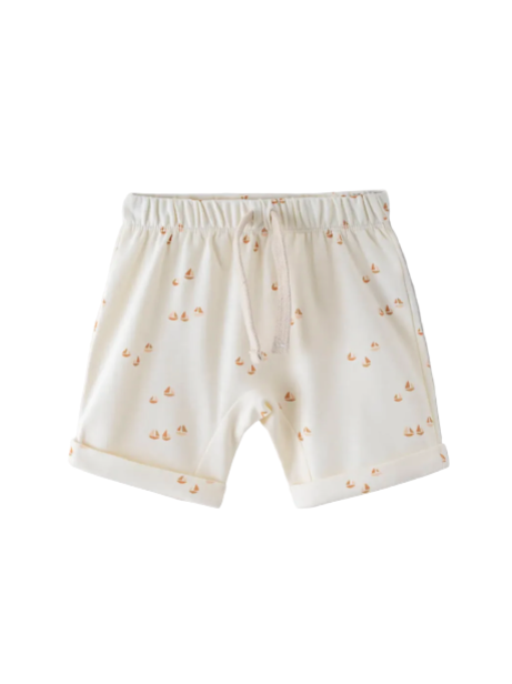 Beige saiilboat shorts with small patterns on a white background