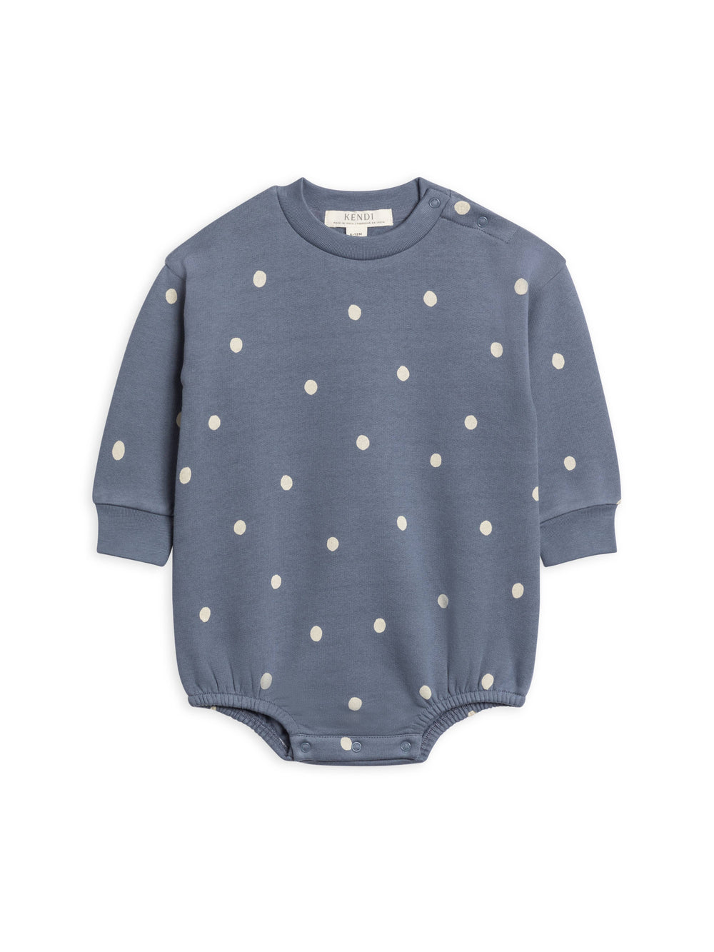 Blue baby romper with white polka dots on a white background