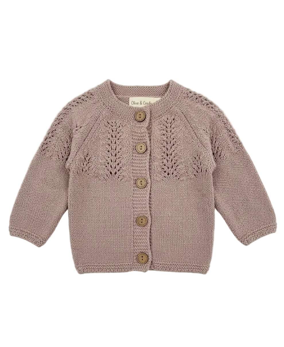 Knitted baby cardigan with button details on a white background