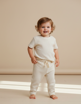 Organic cotton seersucker baby pants in dune stripe – view 2