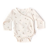 Baby onesie with long sleeves and a pattern on a white background